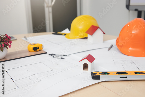 Engineer and Architect concept, Engineer Architects and Interior designer working with blueprints