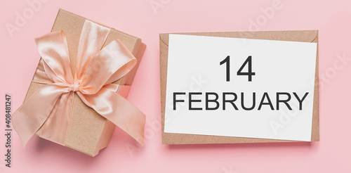 Gifts with note letter on isolated pink background, love and valentine concept with text14 february
