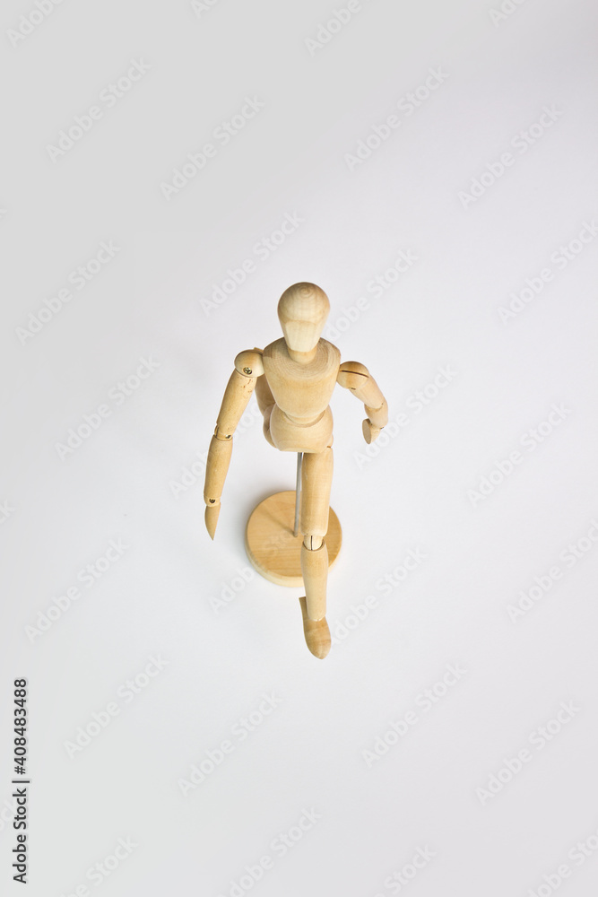 Walking wooden doll. Isolated on white background. Walking wooden doll. Isolated on white background.
