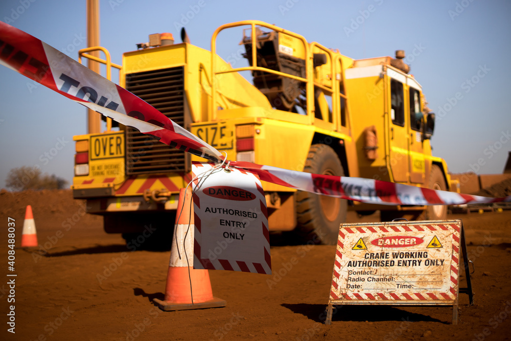 Safe workplace practice red and white warning danger tag tape sign applying taping off working