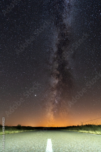 Empty road and milky way over it