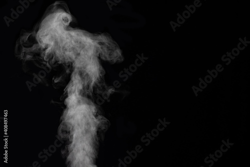 Fototapeta Naklejka Na Ścianę i Meble -  Figured smoke on a dark background. Abstract background, design element, for overlay on pictures.