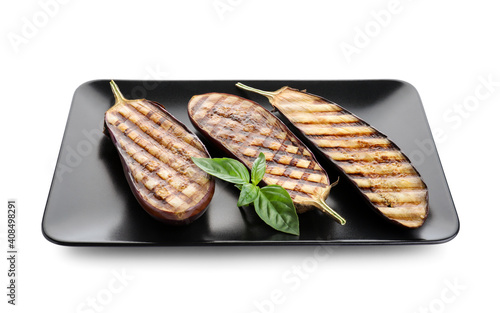 Delicious grilled eggplant halves with basil isolated on white
