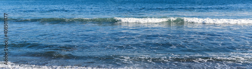 Waves at the seashore. Selective focus with shallow depth of field.