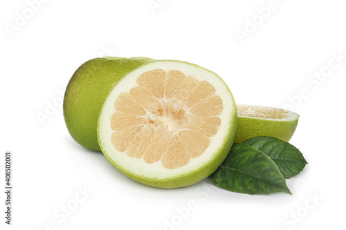 Whole and cut sweetie fruits with green leaves on white background