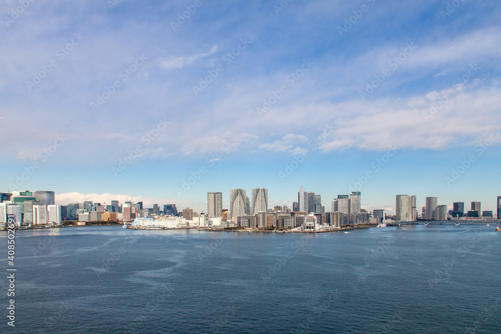 Panoramic Tokyo cityscape facing the bay of water