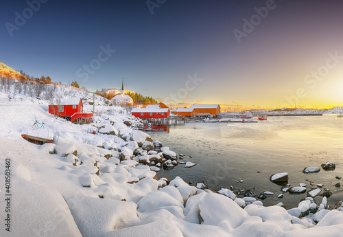 Awesome winter scenery of Moskenes village with ferryport and famous Moskenes parish Churc photo