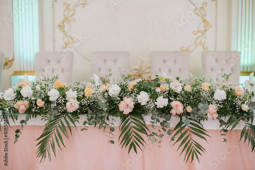 Bride and groom table decorated with beautiful flowers