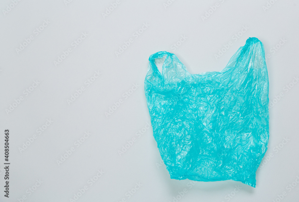  disposable plastic bag on gray background. Space for text