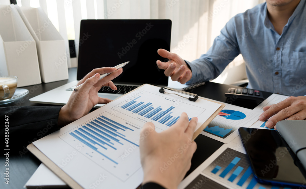 A group of professional business people sit on a meeting table in the office to discuss banking issues. Share partner A meeting idea that talks about a graph A group of professional business people sit on a meeting table in the office to discuss banking issues. Share partner A meeting idea that talks about a graph