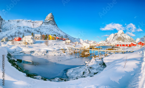 Splendid winter sunny view on Hammarskaftet Mountain Peak with footbridge above Gravdalbukta bay © pilat666