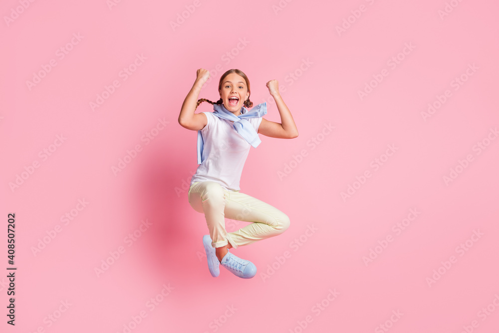 Full size photo of hooray girl fists up wear white t-shirt sweater trousers sneakers isolated on pink background - obrazy, fototapety, plakaty 