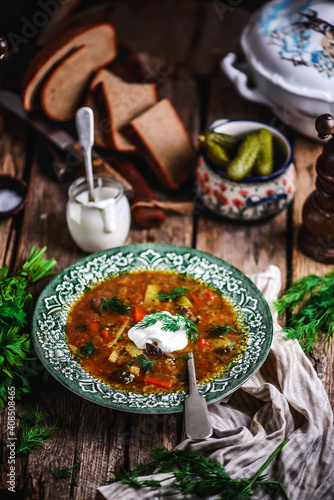 rassolnik ,traditional russian soup with pickles.style rustic photo