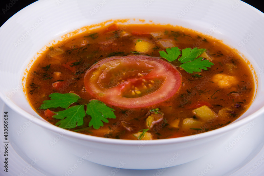 Hungarian goulash - thick vegetable soup with beef and tomatoes Hungarian goulash - thick vegetable soup with beef and tomatoes