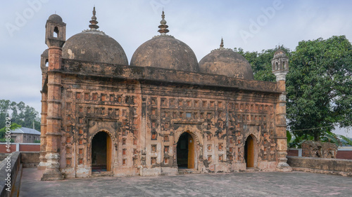 View of ancient Nayabad rural mosque with terracotta facade in Dinajpur district, Bangladesh