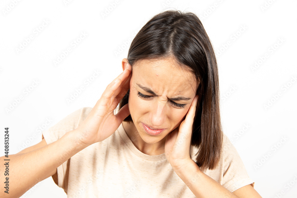 Healthcare or medical concept. Closeup portrait of a young hispanic woman whith her hands on ears suffering earache or ear pain. Healthcare or medical concept. Closeup portrait of a young hispanic woman whith her hands on ears suffering earache or ear pain.