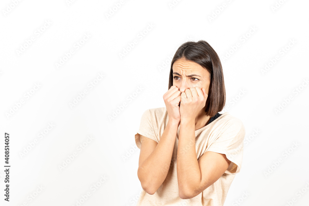 A frightened latin young woman. Mental health and psychology concept. A frightened latin young woman. Mental health and psychology concept.