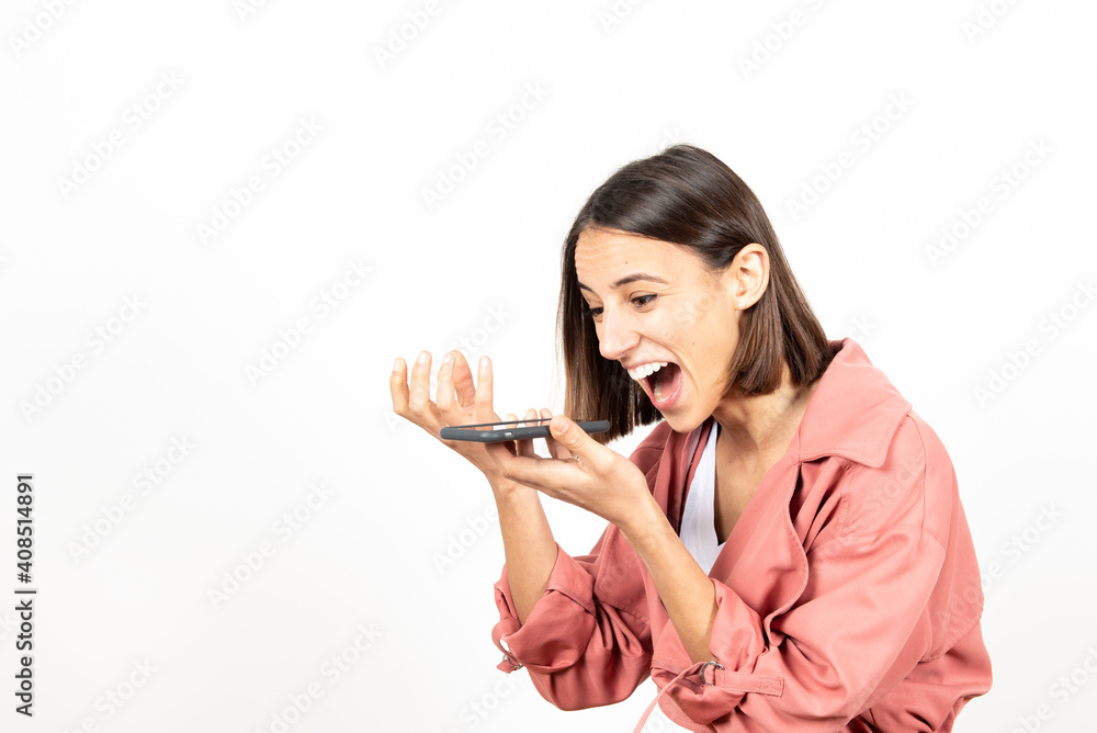 Excited hispanic woman telling a good new through her mobile phone. Excited hispanic woman telling a good new through her mobile phone.