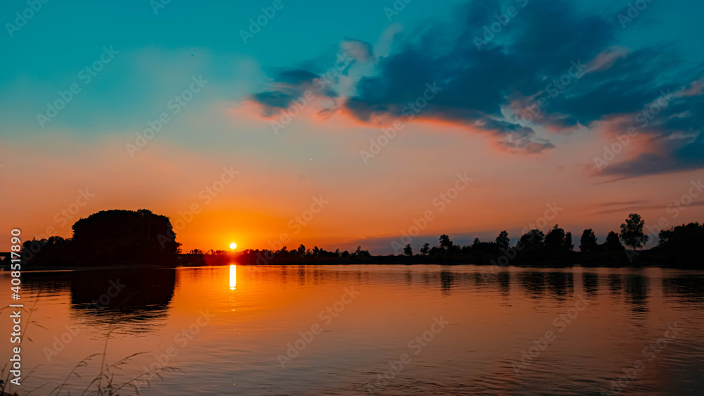 Beautiful sunset with reflections near Mettenufer, Danube, Bavaria, Germany
