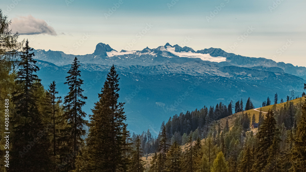 Obraz premium Beautiful alpine summer view with a far view of the Dachstein summit at the famous Tauplitzalm, Salzkammergut, Steiermark, Austria