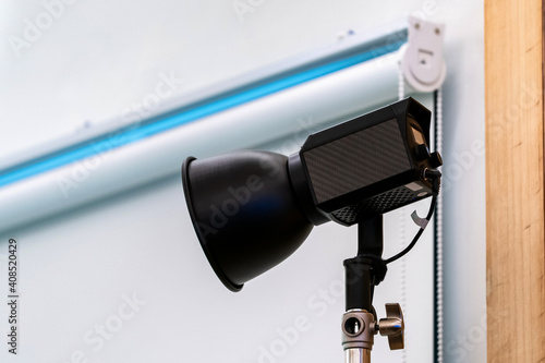 close up to Studio LED sportlight on tripod and standy in the event room.