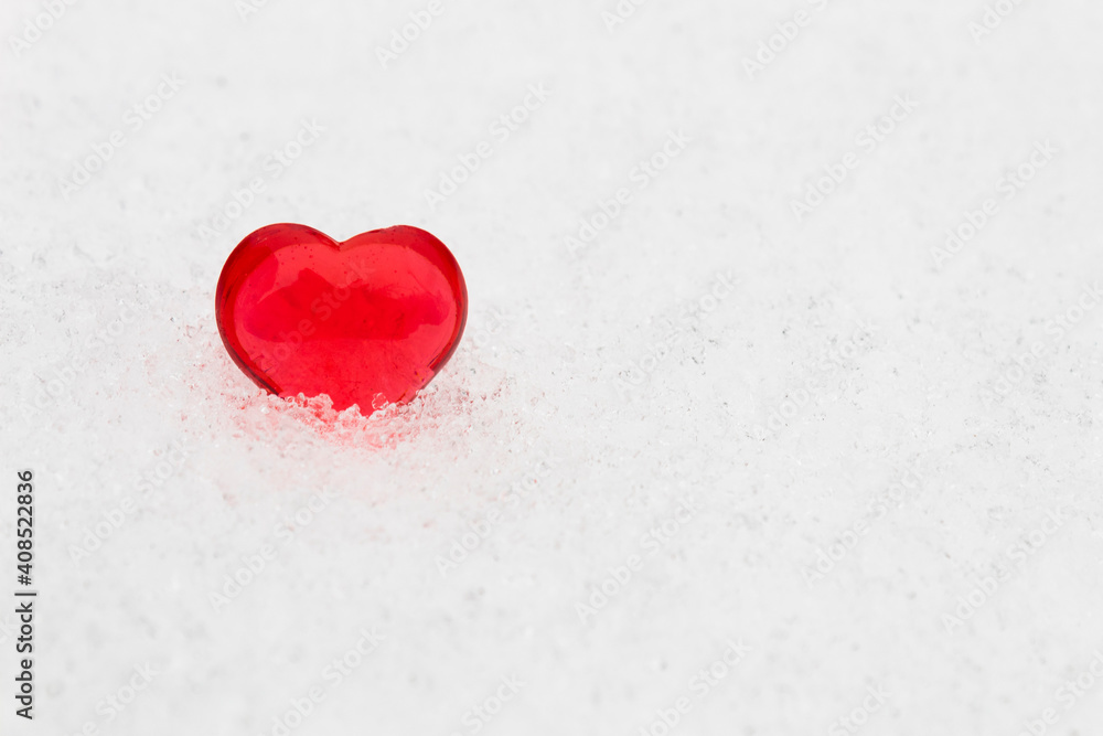Little red heart in the snow (valentine's day greeting card, selective focus) Little red heart in the snow (valentine's day greeting card, selective focus)