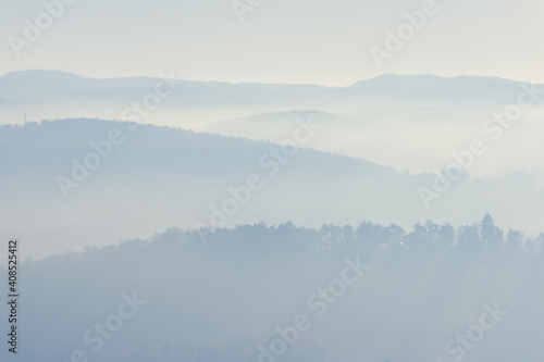 Landscape with hills in soft light and fog