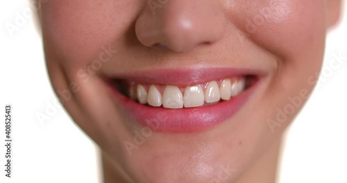 Young woman with beautiful smile on white background, closeup