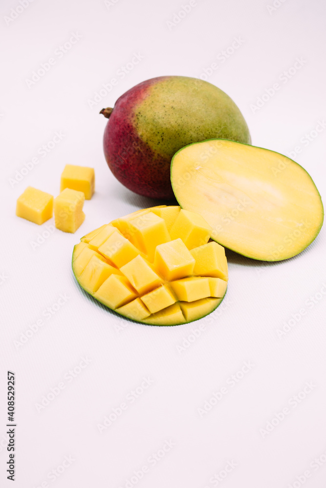 Ripe mango on a white background.