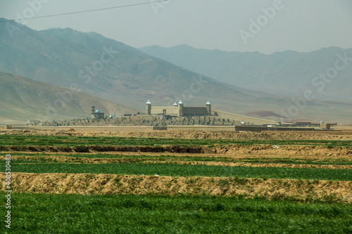 Old armoured vehicles military escorts, guns and tanks in Gardez in Afghanistan photo