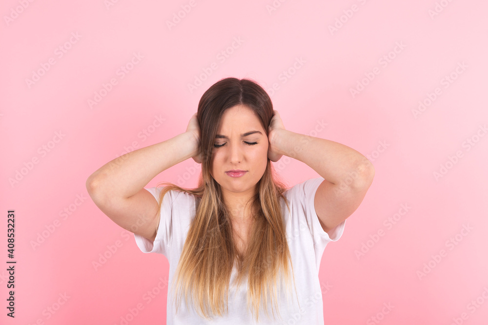 young woman covering her ears. Annoying noise young woman covering her ears. Annoying noise