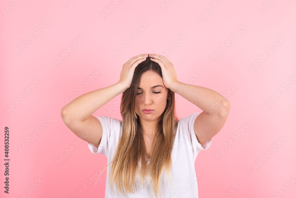 young woman complains of pain with her hands on her head. Headache young woman complains of pain with her hands on her head. Headache
