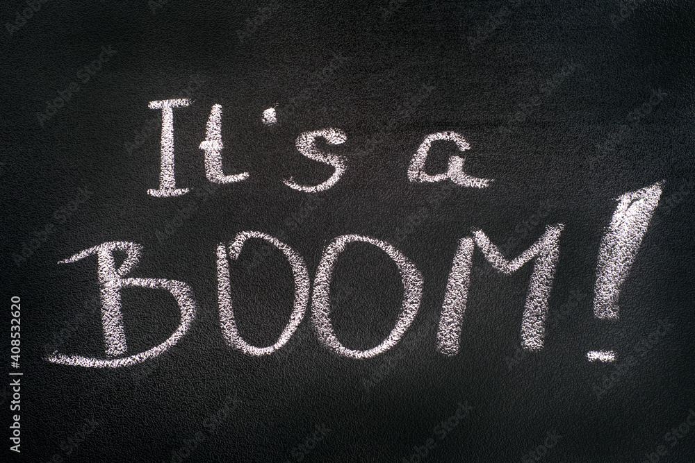 Fototapeta premium Words It's A BOOM! chalk written on blackboard.