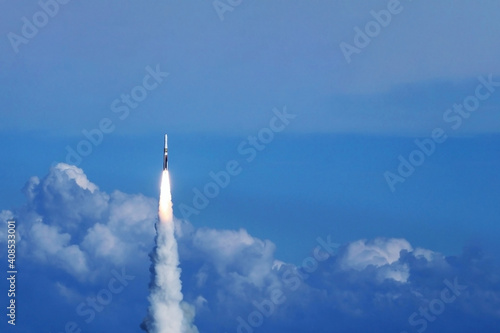 Launch of a space rocket into space. Against the background of the sky. Elements of this image were furnished by NASA.