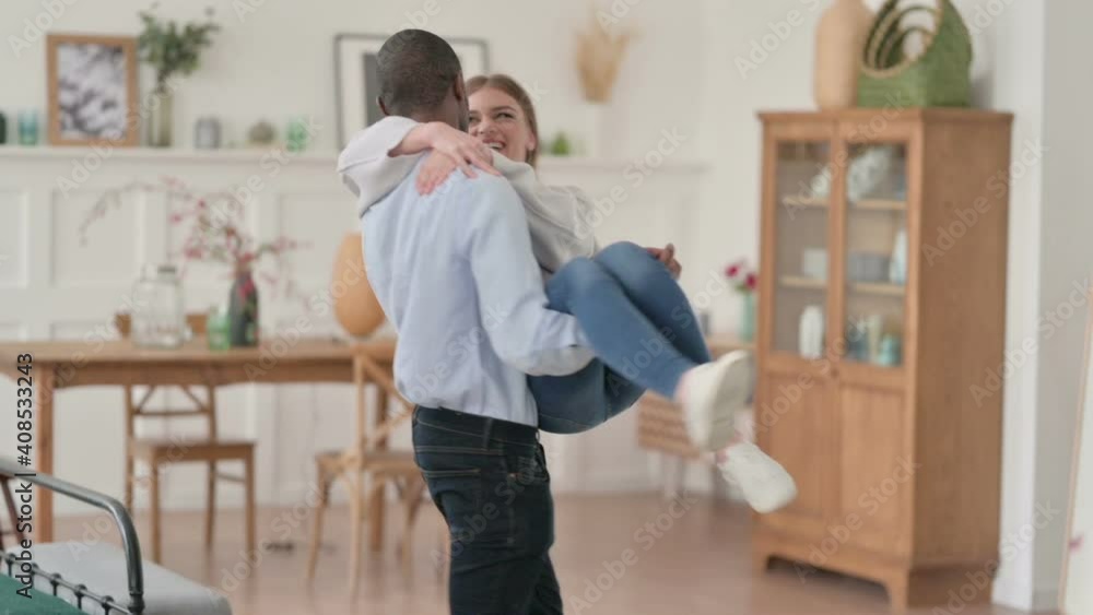 Slow Motion of African Man Swirling with Caucasian Woman in Arms Slow Motion of African Man Swirling with Caucasian Woman in Arms