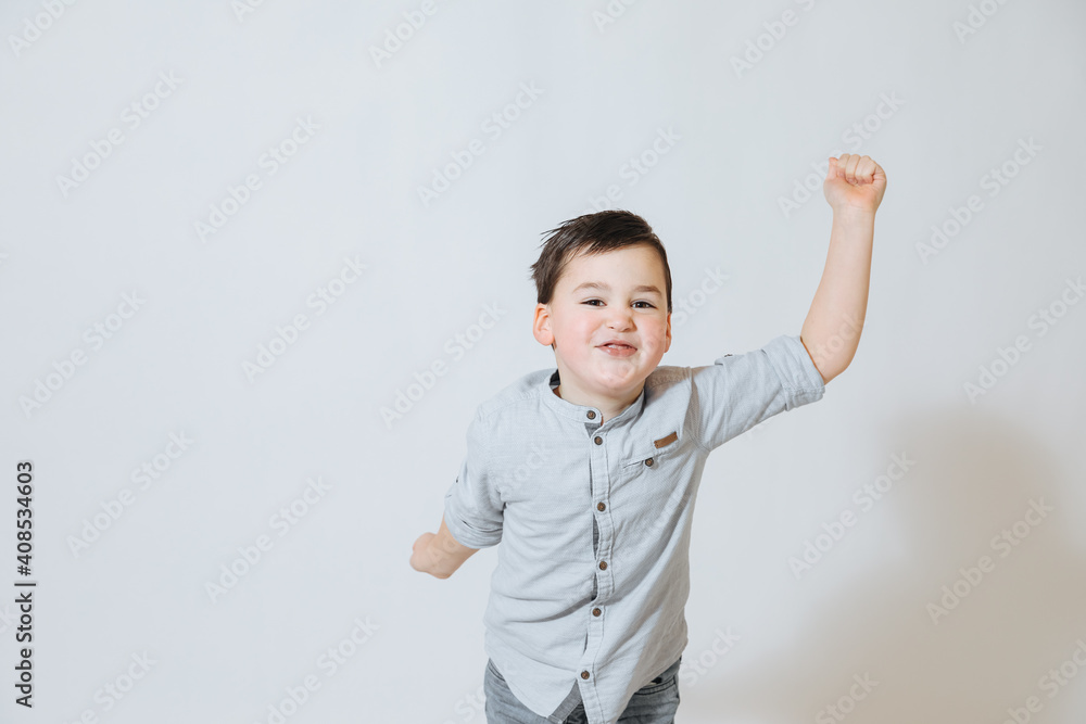Little boy jumps up and has great fun Little boy jumps up and has great fun