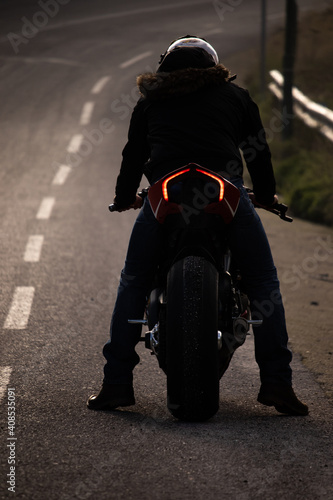 A man is doing burnout his motorcycle tire