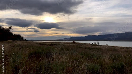 The Bay of Wulaia in Chilean Patagonia and the archaeological site. This place was once inhabited by the Yamana Indians. Beautiful are the sunsets over the bay. Typical Patagonian vegetation. photo