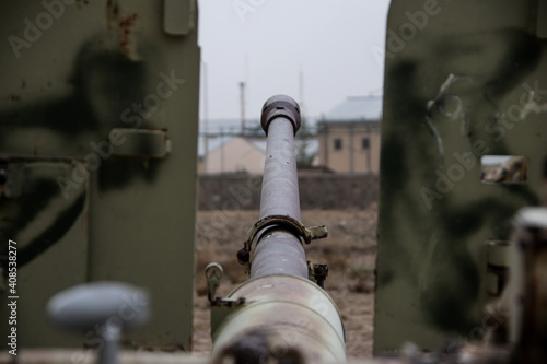 Old armoured vehicles military escorts, guns and tanks in Gardez in Afghanistan photo