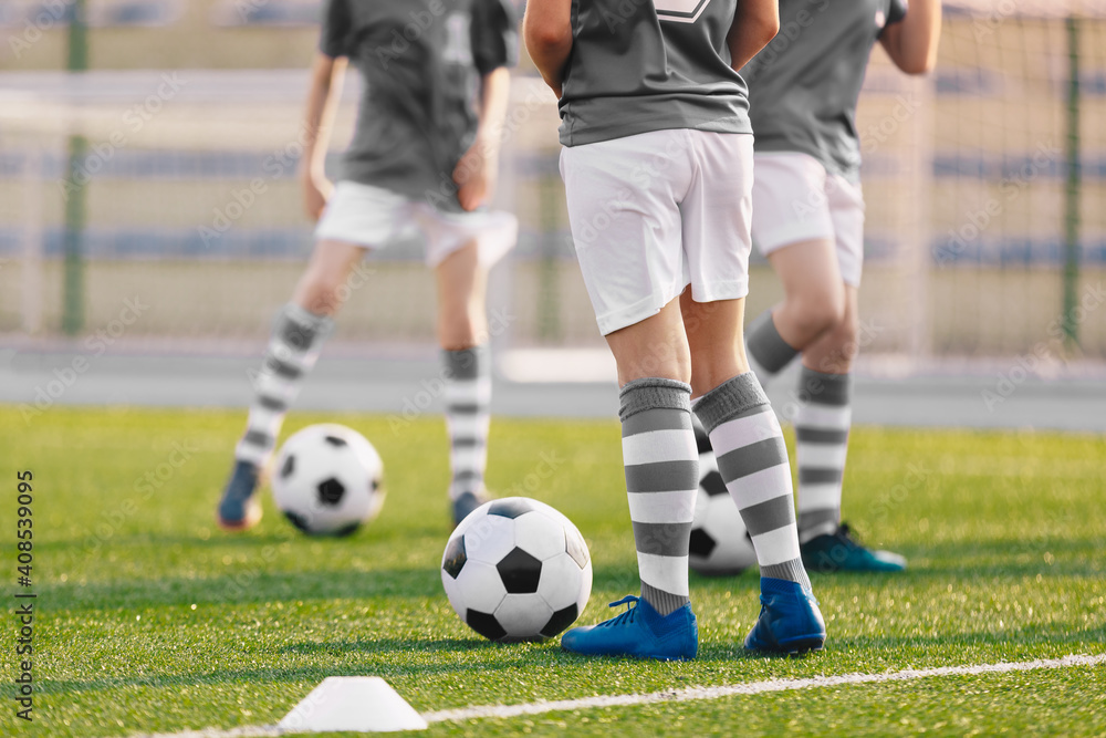 Group of Boys on Soccer Training. Players Practicing European Football on a Summer Day. Children Playing Sports on School Grass Stadium