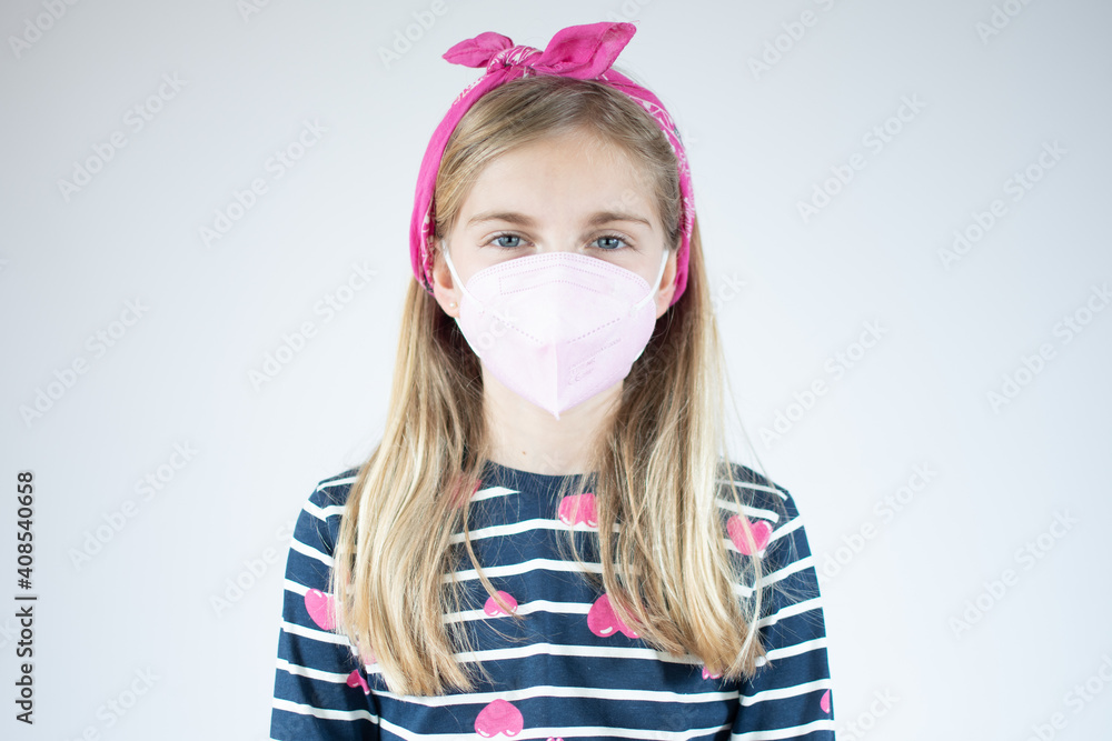 Infection concept. Portrait of little girl wearing medical mask over white background