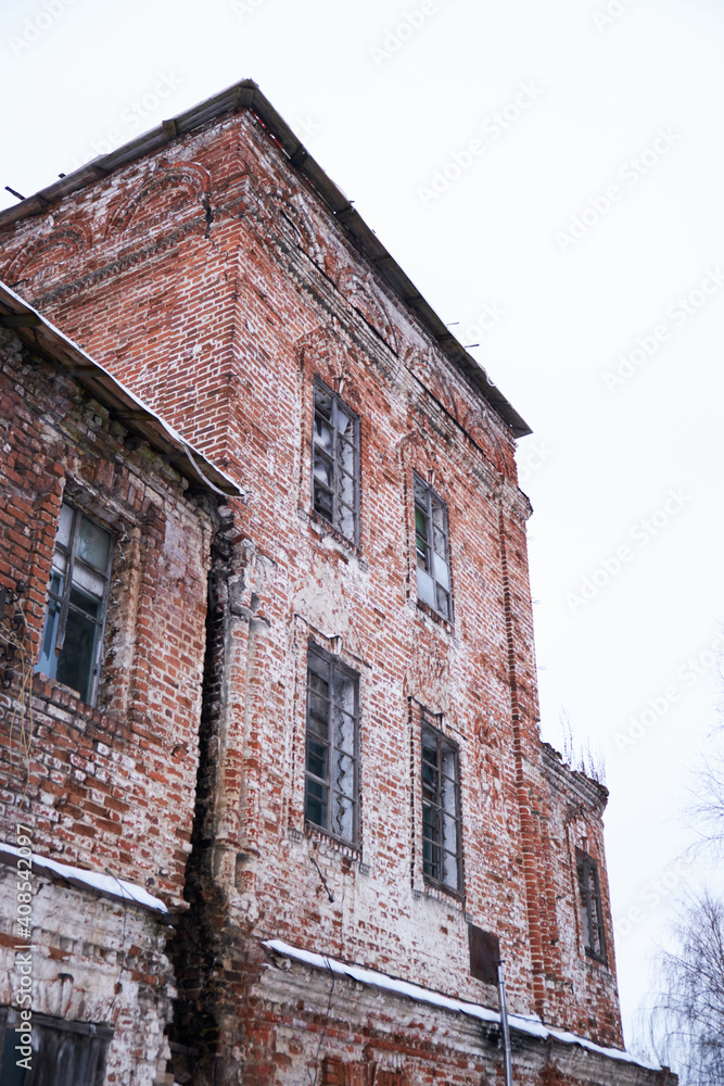 Old and ruined brick church in cold winter Old and ruined brick church in cold winter