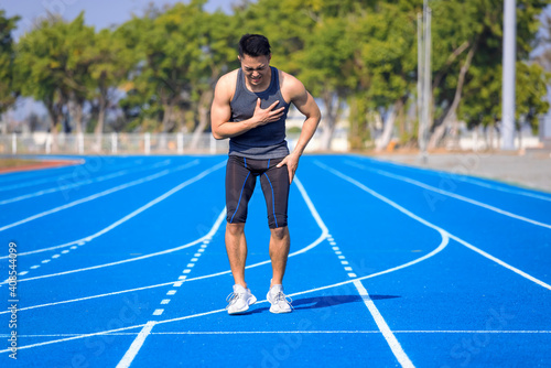 Male runner athlete chest injury and pain