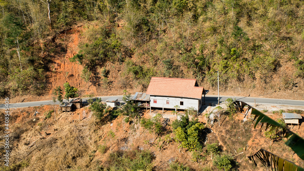 A House in the Roadside to Luang Prabang Province. Landscape of National Route 13 North to Luang Prabang Province. A House in the Roadside to Luang Prabang Province. Landscape of National Route 13 North to Luang Prabang Province.