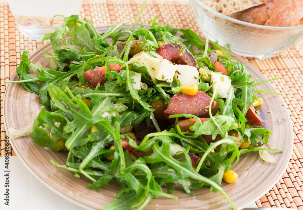 mixed salad of arugula and fresh vegetables with sauce mixed salad of arugula and fresh vegetables with sauce