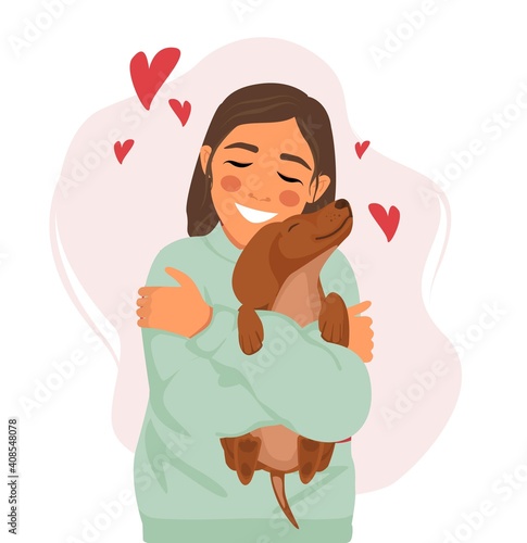 Happy smiling woman loves and hugs a dachshund dog. Love to the animals.