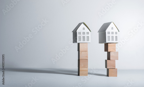 Real estate concepts with model house on wood box.business investment