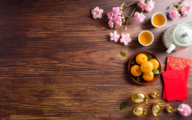 Top view for Happy Chinese new year or Lunar new year festival decorations on old wooden background. ( Chinese characters "FU" in the article meaning for fortune, good luck )