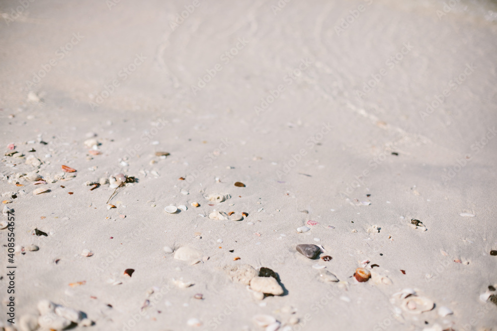 White sand beach with small rocks White sand beach with small rocks