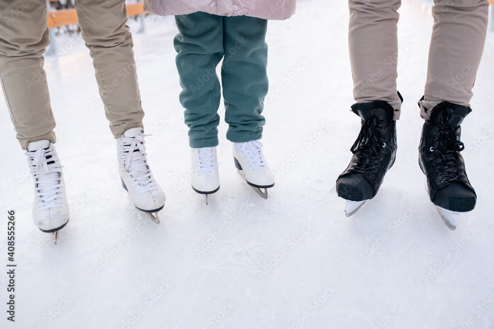 Family standing on skates Family standing on skates
